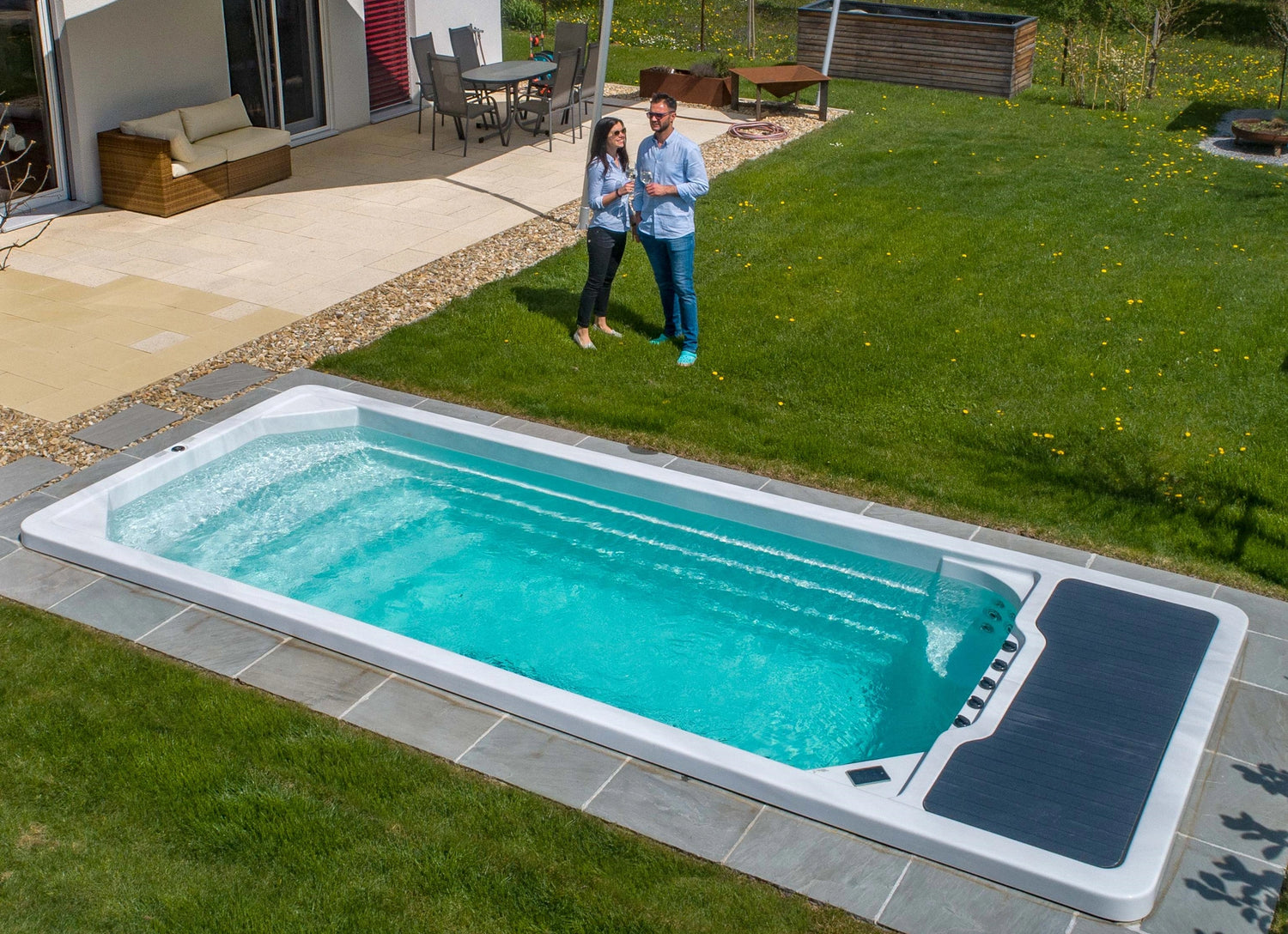A beautiful swim spas recessed into the group making the perfect addition to your garden